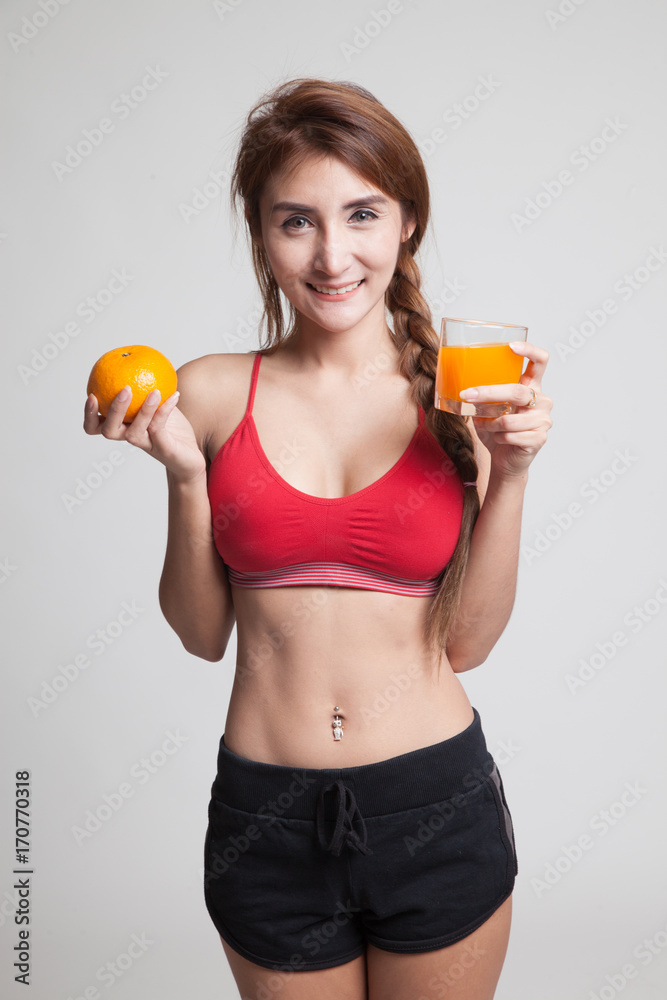 Beautiful Asian healthy girl with orange juice and orange fruit. Beautiful Asian healthy girl with orange juice and orange fruit.
