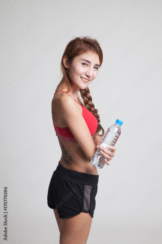 Beautiful Asian healthy girl with bottle of drinking water. Beautiful Asian healthy girl with bottle of drinking water.