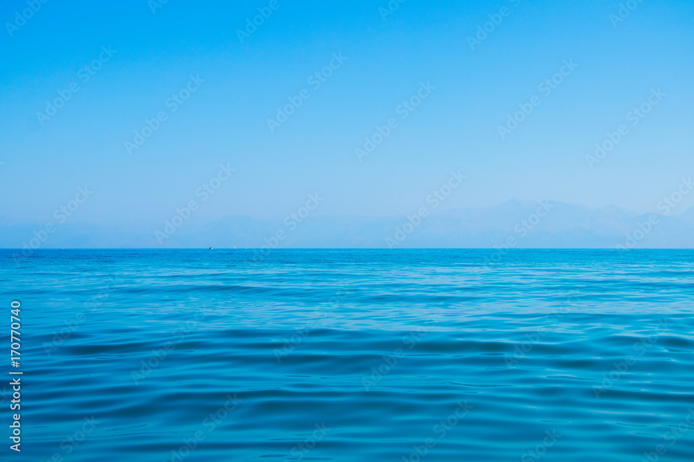 beautiful turquoise sea water with blue sky in a cloudless summer day