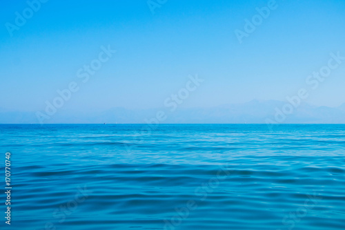 beautiful turquoise sea water with blue sky in a cloudless summer day