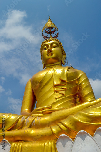 Gold Buddha statue in Tiger Cave Temple near Krabi Thailand