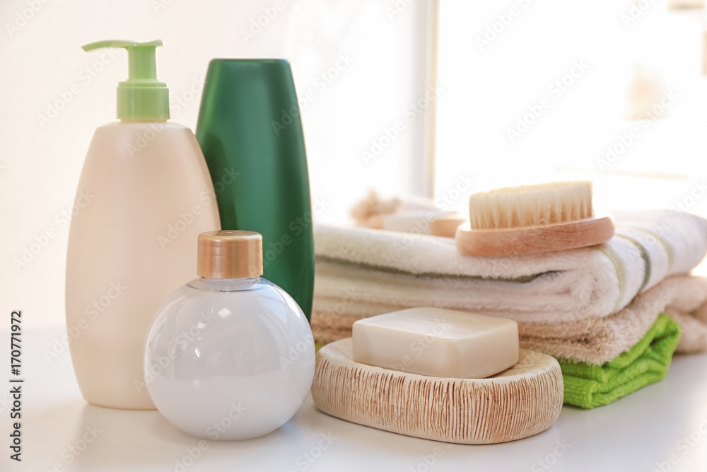 Composition with bath cosmetics and accessories on table Composition with bath cosmetics and accessories on table