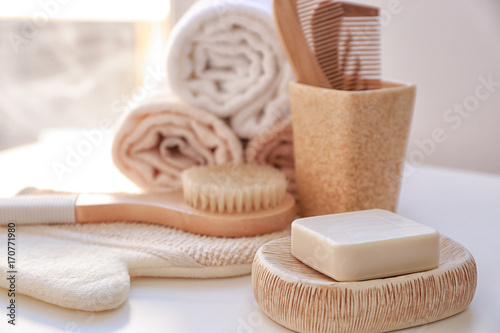 Composition with soap and bath accessories on table photo