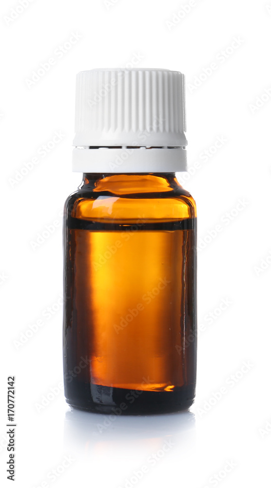 Glass bottle with essential cinnamon oil on white background Glass bottle with essential cinnamon oil on white background