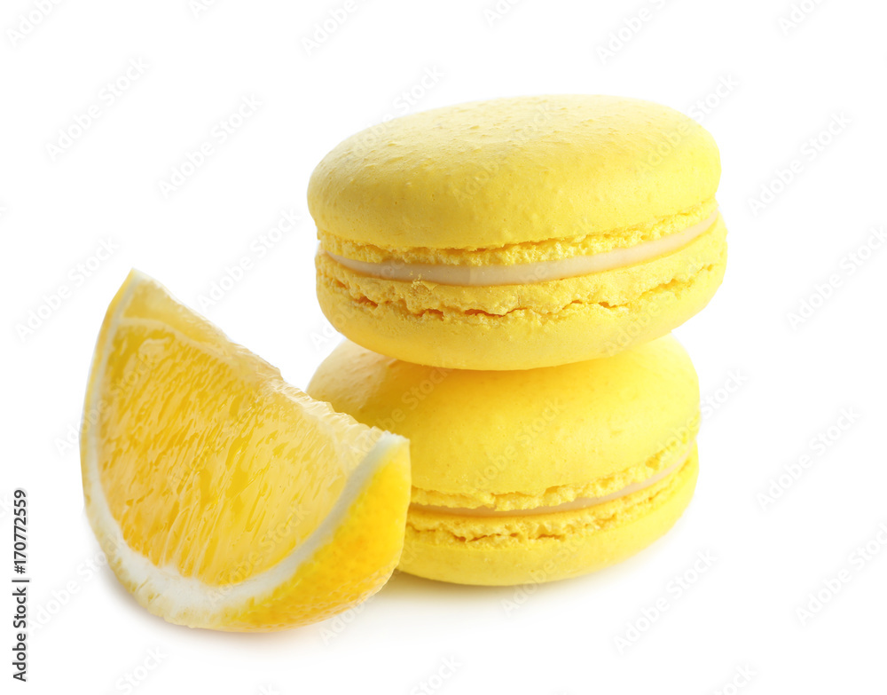 Lemon macarons and sliced fruit on white background Lemon macarons and sliced fruit on white background