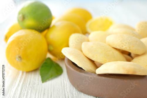 Plate with homemade lemon cookies on table