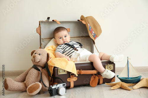 Cute little boy lying in su...