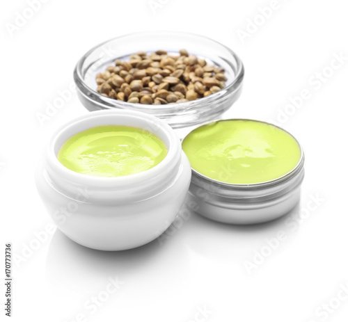 Composition with hemp lotion on white background