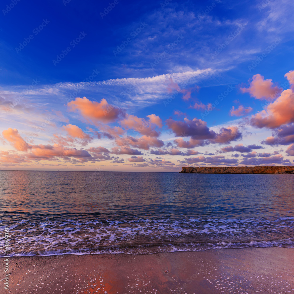 Beautiful colorful sunrise at the sea with dramatic pink clouds over ...