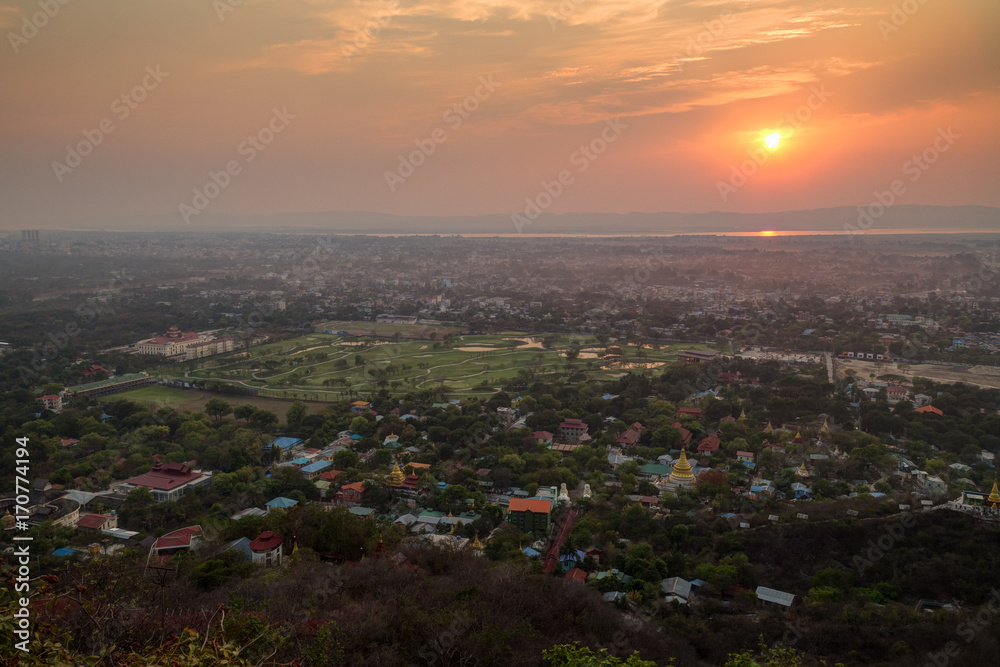 Beautiful sunset in Mandalay,  Myanmar (Burma), viewed from above from the Mandalay Hill.
