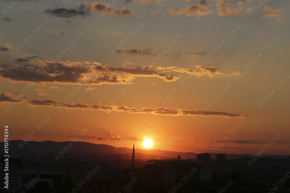Naklejka premium Sunset over Ankara Turkey skies. beautiful landscape with a red sunset sky over the field