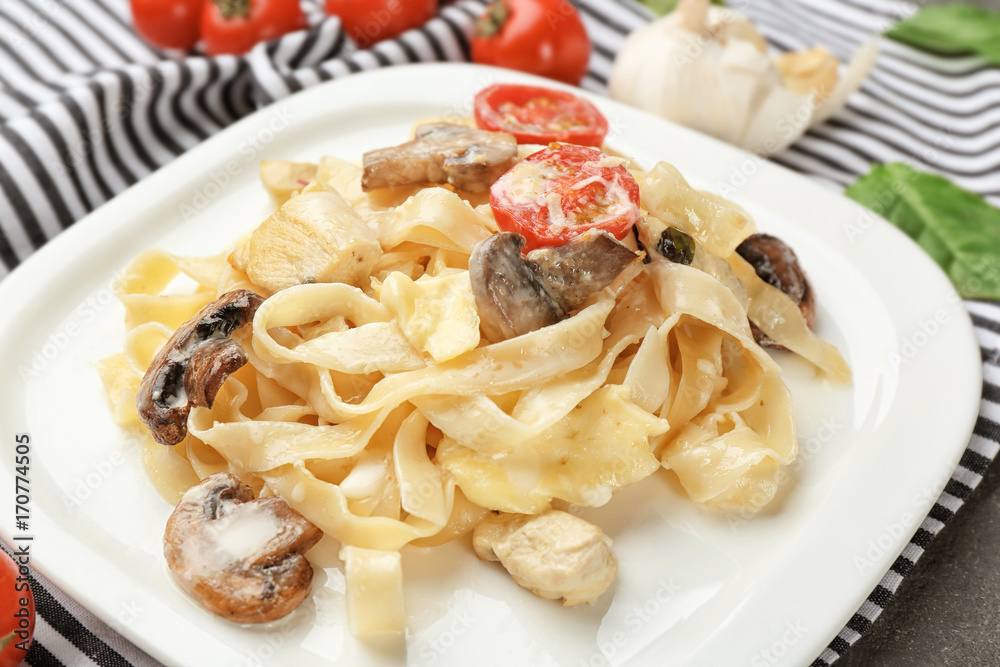 Plate with delicious turkey tetrazzini on napkin, close up Plate with delicious turkey tetrazzini on napkin, close up