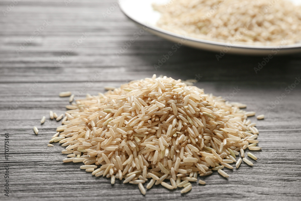 Pile of long grain brown rice on table Pile of long grain brown rice on table