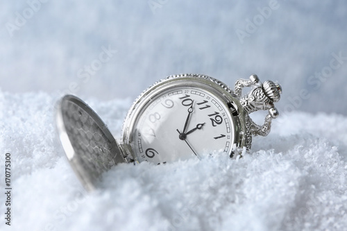 Watch on snow, close up. Christmas countdown concept