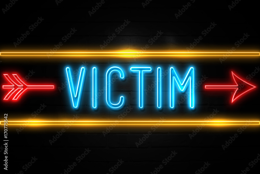 Victim  - fluorescent Neon Sign on brickwall Front view