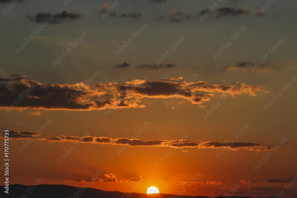 Naklejka premium Sunset over Ankara Turkey skies. beautiful landscape with a red sunset sky over the field