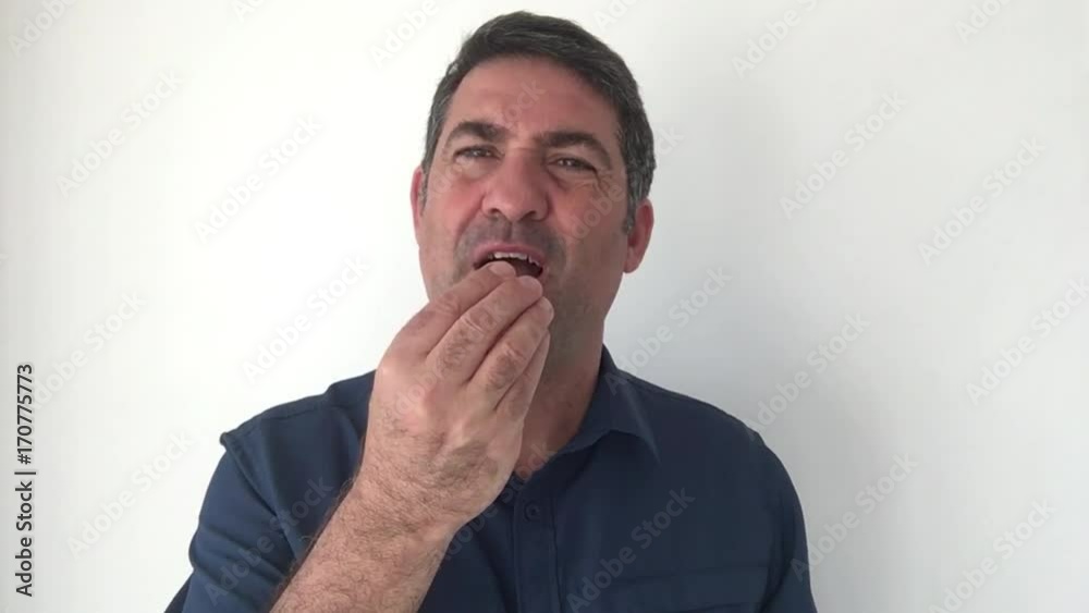 Italian man demonstrate Can we eat sign of Italian hand gestures. Body language and facial expression communication concept. Real people. copy space Italian man demonstrate Can we eat sign of Italian hand gestures. Body language and facial expression communication concept. Real people. copy space