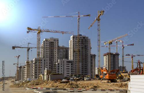 New city in construction - High-rise residential buildings and cranes photo