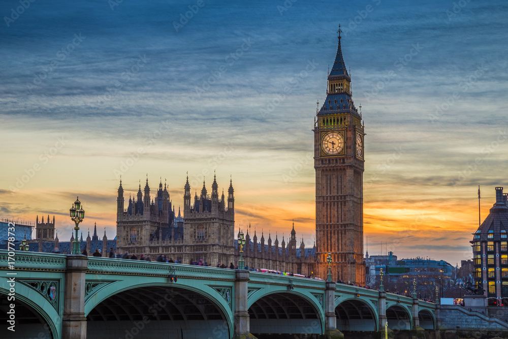 London, England - The iconic Big Ben, Houses of Parliamen and Westminster bridge at sunset with beautiful sky