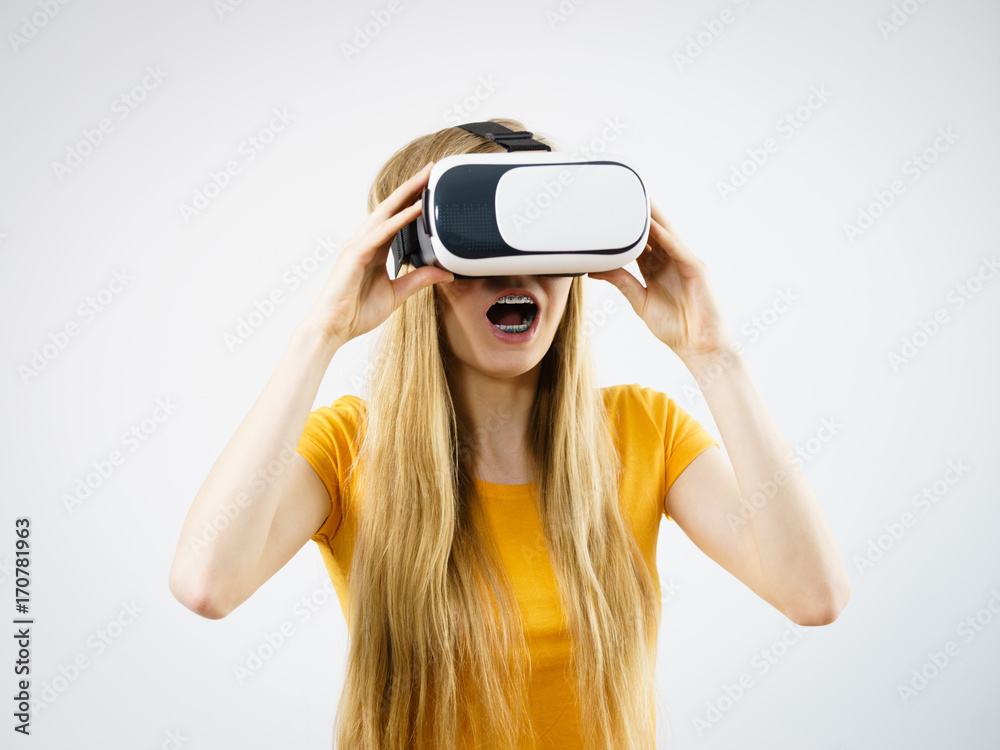 Girl wearing virtual reality goggles. Girl wearing virtual reality goggles.