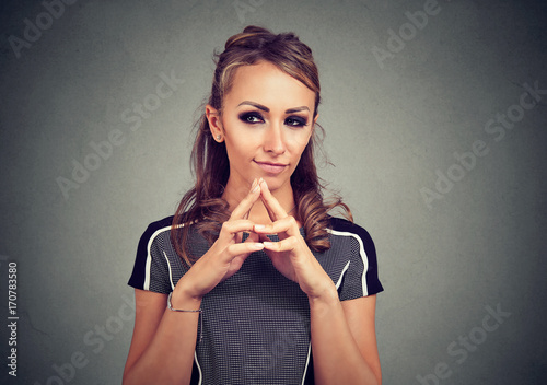 sly, scheming woman plotting something