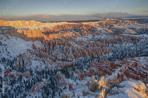 The sunrise over the snow covered red rocks of Bryce Canyon National Park