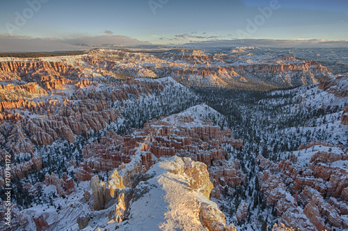 The sunrise over the snow covered red rocks of Bryce Canyon National Park