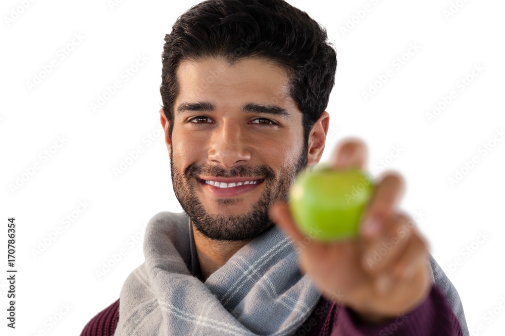 Portrait of man showing green apple Portrait of man showing green apple