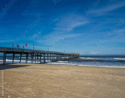 Fishing pier at the sandy beach