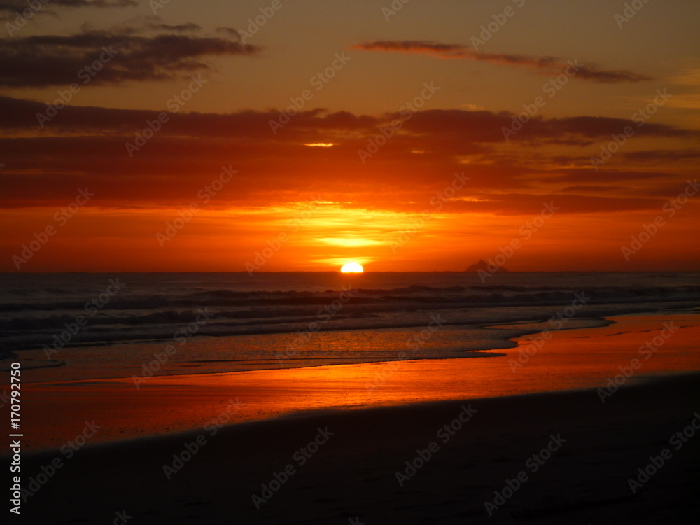 Sunrise out of the Pacific Ocean at Waihi Beach
