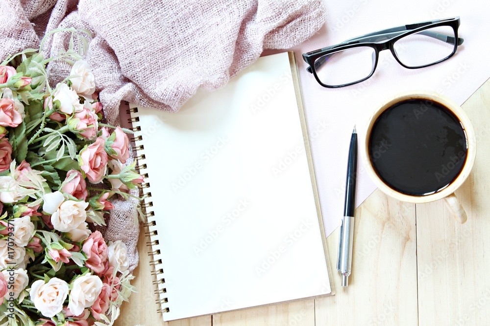Business, weekend, holiday or good morning concept : Flat lay or top view of scarf, open blank notebook paper, coffee cup and eyeglasses on wooden background Business, weekend, holiday or good morning concept : Flat lay or top view of scarf, open blank notebook paper, coffee cup and eyeglasses on wooden background