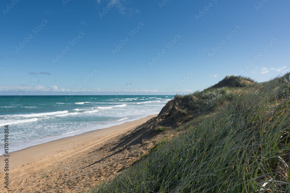 Beach sand dune on sunny day in Coorong National Park, South Australia