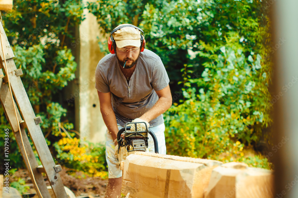 a man is sawing a log with a saw a man is sawing a log with a saw