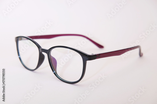 Glasses on a pink background. Fashionable glasses for the eyes. Trend of the year.