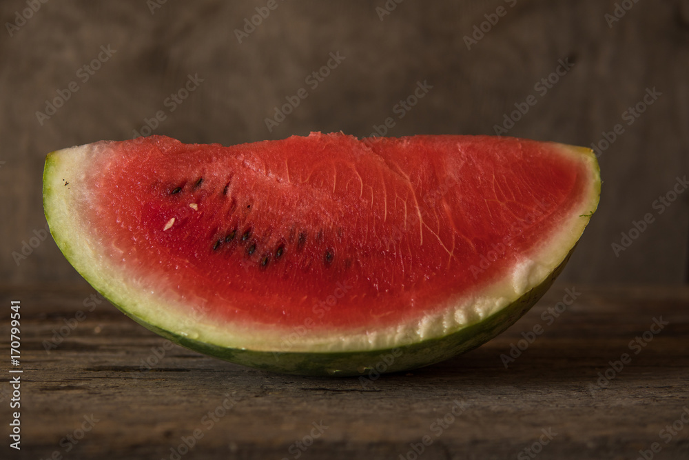 Watermelon slices on the woodan table. Fresh red watermelon. Rustical style. Watermelon slices on the woodan table. Fresh red watermelon. Rustical style.
