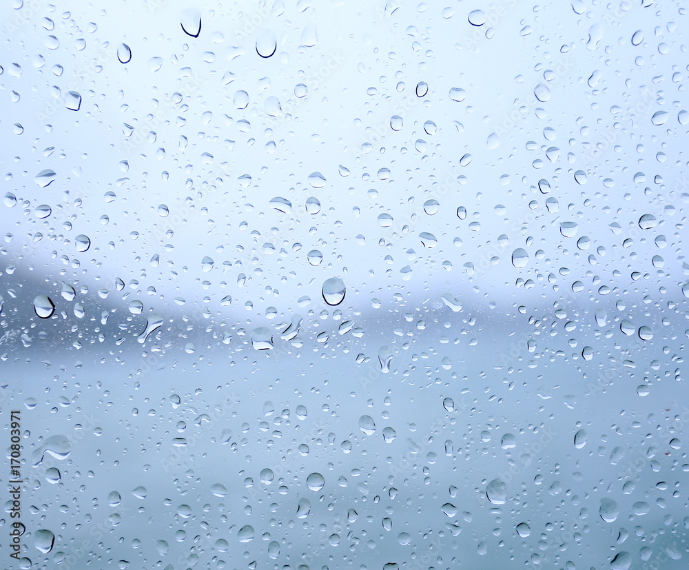raindrops on glass, on a background of sea. raindrops on glass, on a background of sea.