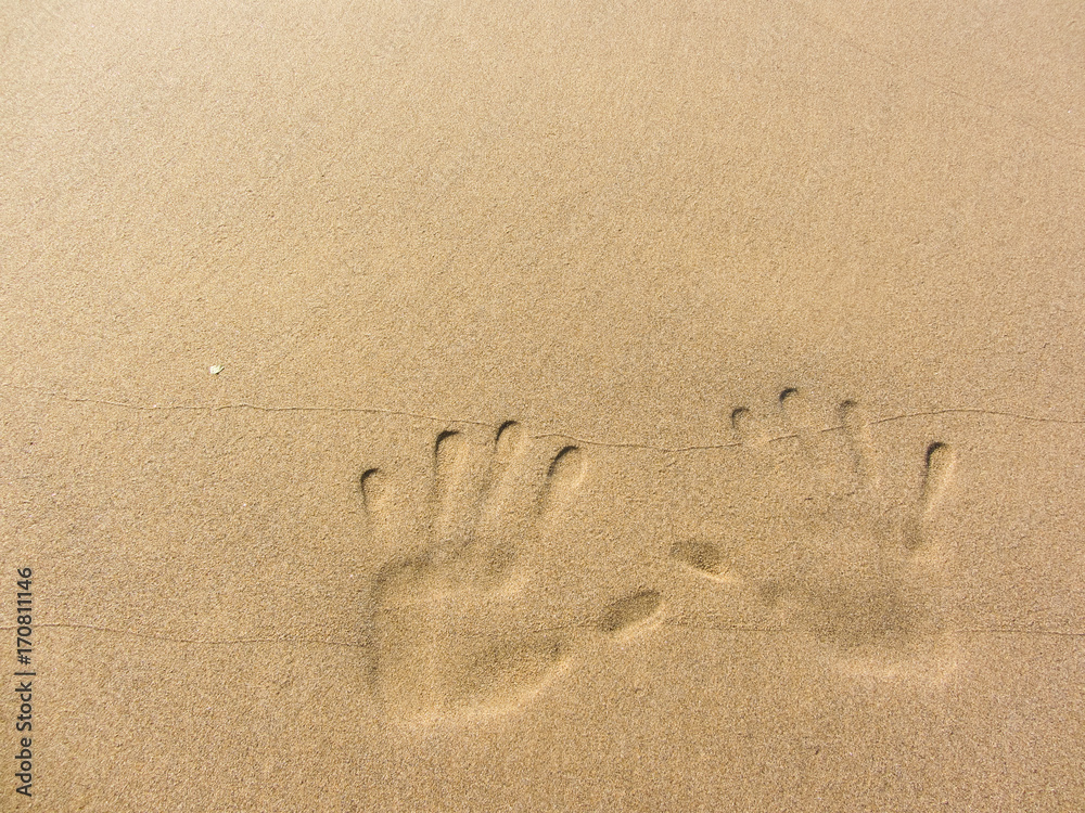 playing with sand long the shoreline playing with sand long the shoreline