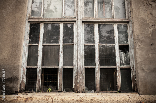 A window with a broken window pane. Broken glass. photo