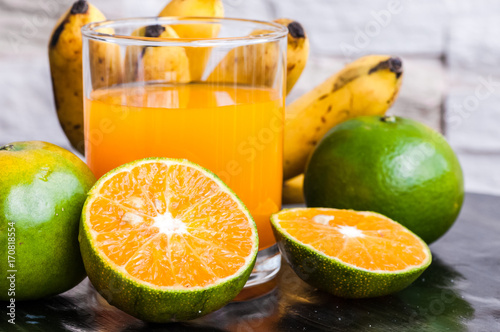 Fototapeta Naklejka Na Ścianę i Meble -  orange juice and tropical fruits