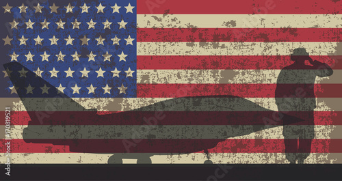 Military aircraft and serviceman on the background of the US fla