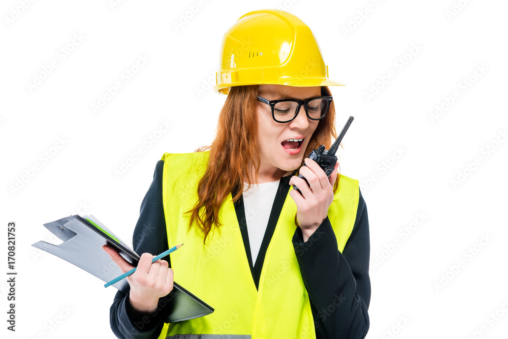 woman foreman with radio and folder on white background