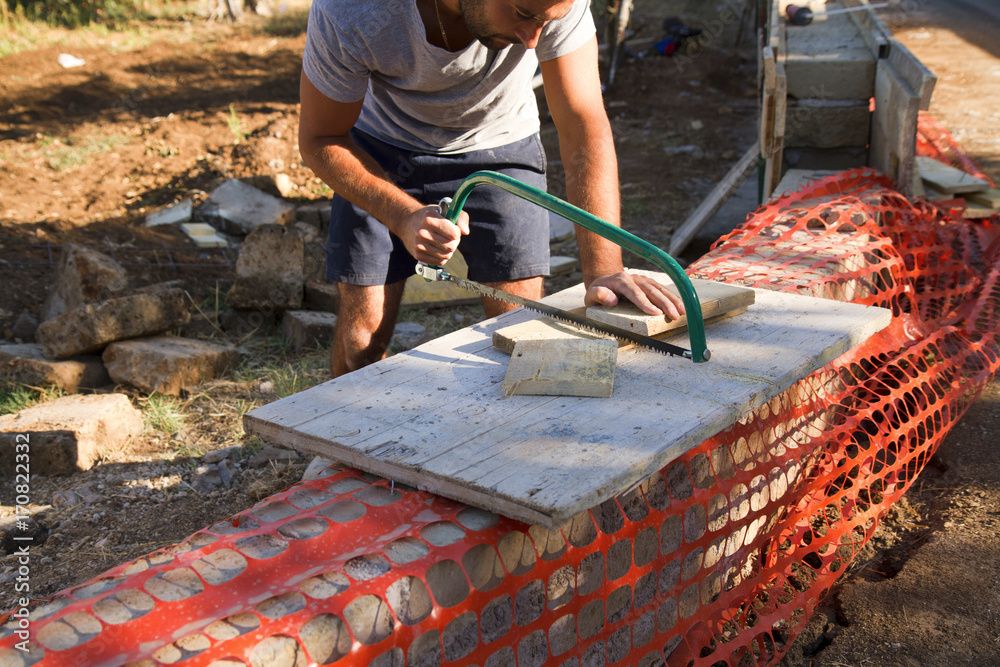 bricklayer building a new wall in a site bricklayer building a new wall in a site