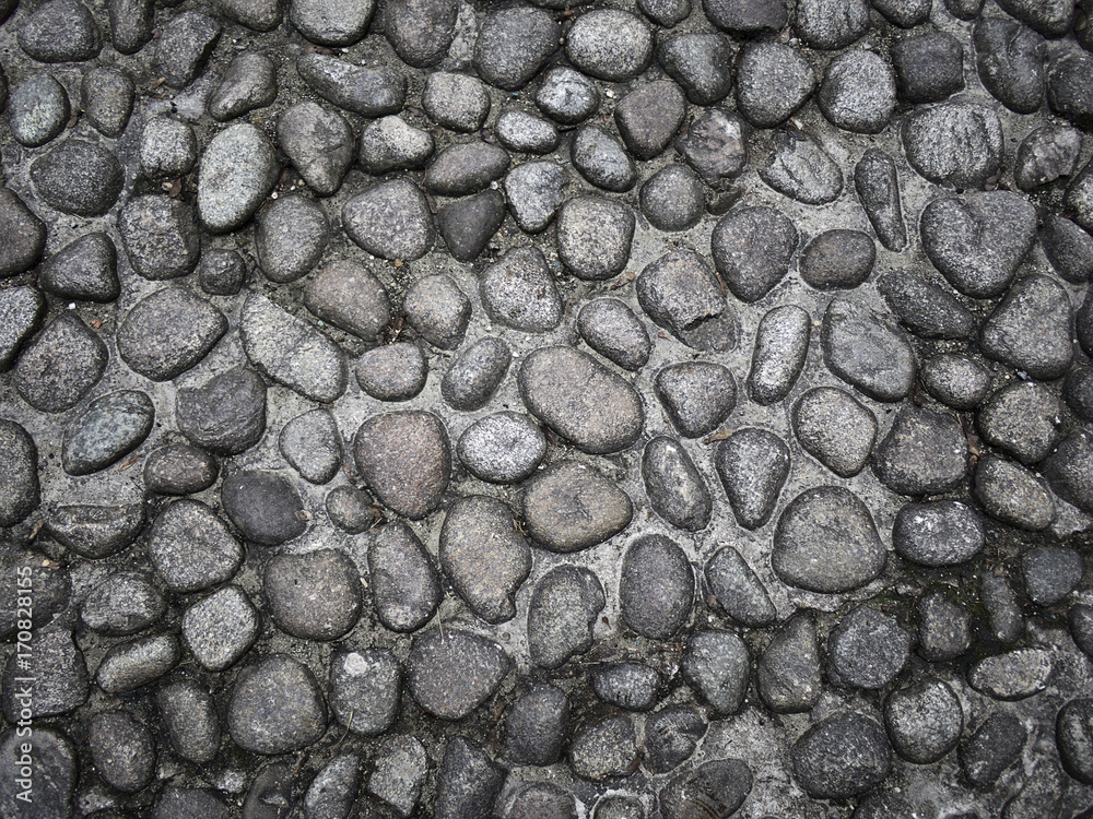 Old cobblestone pavement pattern closeup. Old cobblestone pavement pattern closeup.