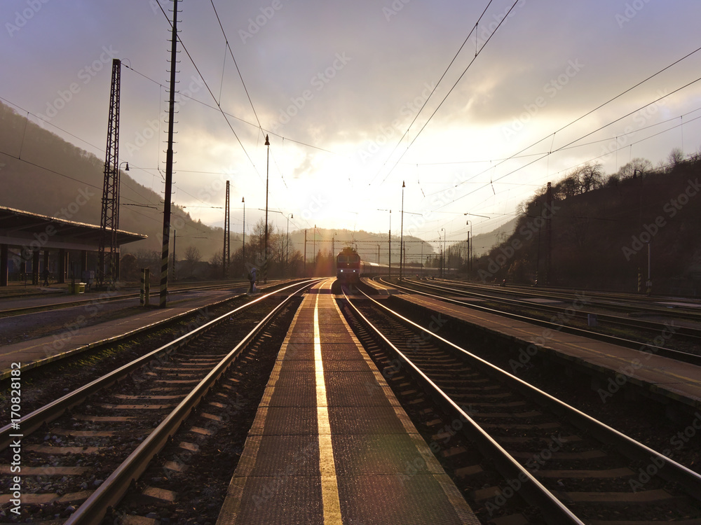 Beautiful sunset at empty countryside train station.