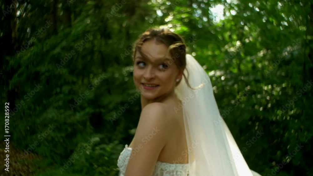 Girl runs through the forest and turns around close up Girl runs through the forest and turns around close up