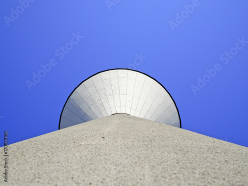 Under water tank tower and deep blue sky. Architecuric background.