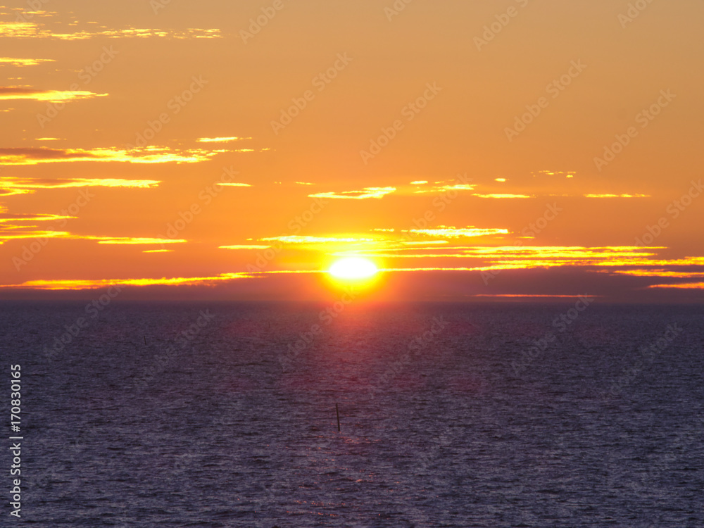 Obraz premium Beautiful golden sunset over the sea.