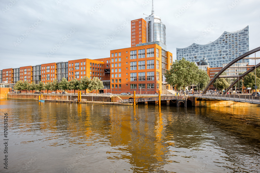 View on the water channel with old bridge and modern office district in Hamburg, Germany