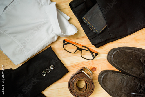 man casual outfits fashion accessories wooden table, (shirt,jean,wallet,sunglasses,glasses,Belt,shoes)