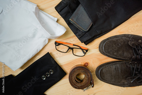 man casual outfits fashion accessories wooden table, (shirt,jean,wallet,sunglasses,glasses,Belt,shoes)